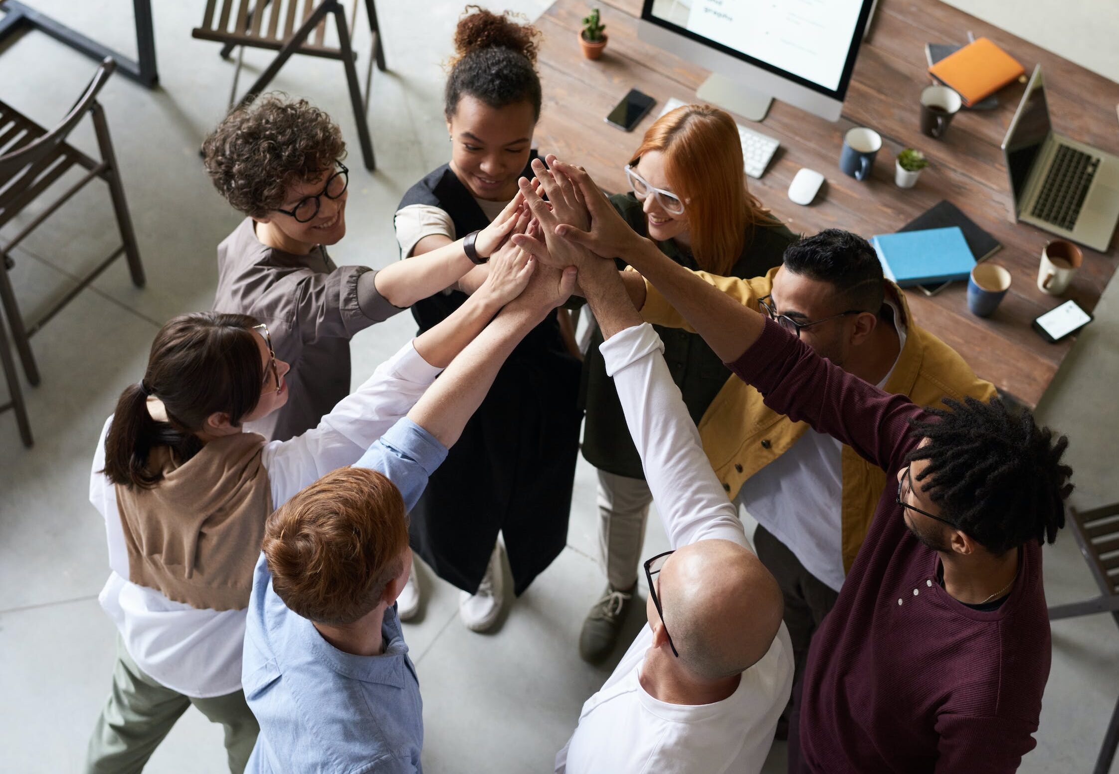 Photo Of People Holding Each Other's Hands